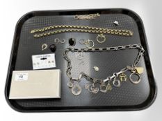 A gold plated belcher-link necklace, a fancy link plated necklace with strung with various pendants,