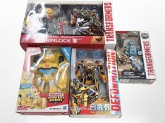 Three Hasbro Transformer toy sets and a further Deformation figure