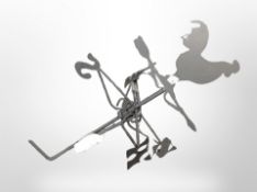 A cast-metal cockerel weather vane.