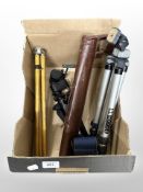 A group of camera tripods