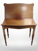 A Victorian walnut turnover top tea table,