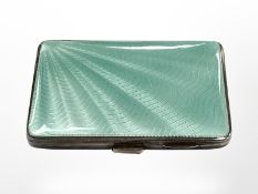 A silver and green enamel Art Deco silver cigarette case, Birmingham 1930, 55 mm x 80 mm.