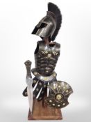 A miniature Roman suit of armour on hardwood stand, height 63cm.