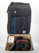 A Roksak bag and a box of guitar leads, strap,