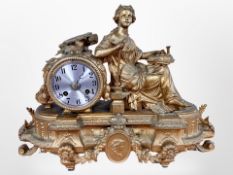 A 19th century French gilt metal figural mantel clock, striking on a bell, with pendulum and key,