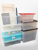 A quantity of plastic storage boxes