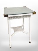 A brass mounted loom occasional table,