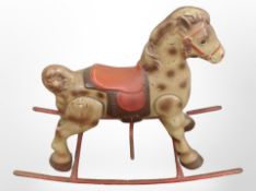 A 20th century child's enamelled and tin rocking horse