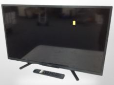 A Sony Bravia 32-inch LCD TV with lead and remote.