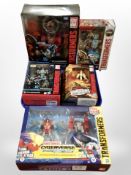 Five Hasbro Transformers models, boxed.