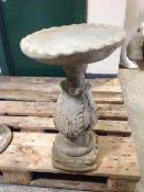 A concrete circular bird bath, height 61cm.