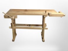 A Scandinavian pine work bench fitted with two vice,