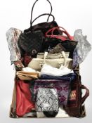 Two boxes containing ladies' handbags.