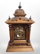 A Victorian walnut bracket clock, with brass dial striking on a gong,