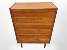 A Danish teak and pine six drawer chest,
