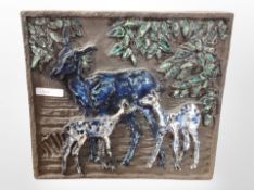 A 20th-century Scandinavian pottery wall plaque depicting deer, 32cm x 28cm.