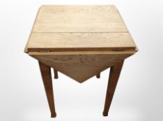 An oak drop leaf table,