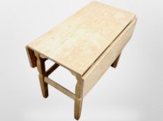 A Danish blond oak drop leaf coffee table,