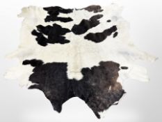 A cow skin rug,