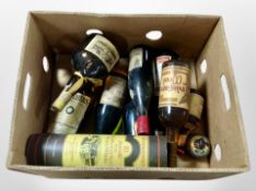 Assorted bottles of alcohol including Gran Marnier, Teacher's Highland Cream Scotch Whisky,
