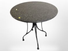 A granite topped patio table,