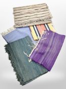 A group of vintage rugs and mats.