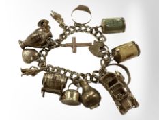 A 9ct gold charm bracelet CONDITION REPORT: 51.