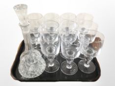 A set of 11 Scandinavian crystal drinking glasses and a mallet-shaped decanter.