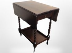 A reproduction oak barley twist trolley