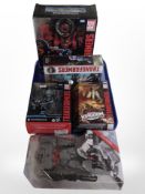 Five Hasbro Transformers models, boxed.