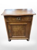 A 19th century Biedermeier walnut pier cabinet,