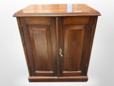 A Victorian mahogany double door cabinet,