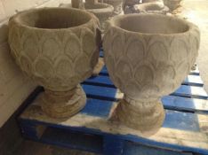A pair of concrete garden planters, height 49cm.