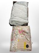 A super king size bed spread, together with a further vintage floral quilt.