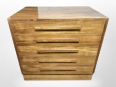 A Danish teak chest of five drawers,