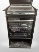 A Technics glass hi/fi cabinet containing Technics,