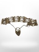 A 9ct gold padlock bracelet CONDITION REPORT: 10.