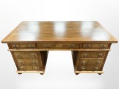 A Barker & Stonehouse flagstone twin-pedestal desk, 165cm wide x 80cm deep x 80cm high.