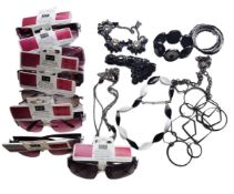 A collection of F&F sunglasses with tags and accessories.