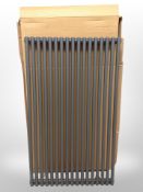 A 1000mm radiator (metallic grey finish).