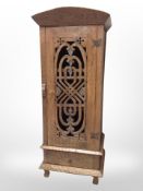 An adzed oak single-door cabinet, 70cm wide x 62cm deep x 173cm high.