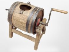 A 19th-century coopered oak butter churn on stand, length 73cm including handle.
