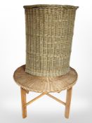 A wicker corner hamper and a further occasional table.