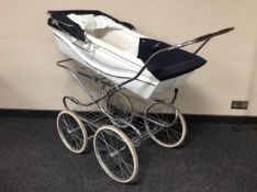 A silver cross pram.