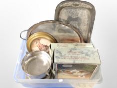 A box containing silver-plated serving trays, hors d'oeurve dish,