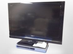 A Sony Bravia 32-inch LCD TV with lead, remote, and instructions,