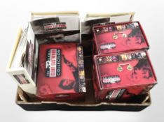 A group of Clint Eastwood Collection DVDs and related magazines in binders.