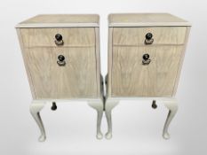 A pair of bleached walnut bedside cabinets on cabriole legs, 42cm wide x 34cm deep x 75cm high.