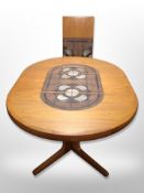 A Danish teak extending table with two leaves, total length 215 cm x 122 cm x 72 cm,