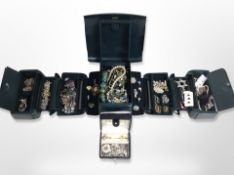 A contemporary fold-out multi compartment jewellery box and a further box of costume jewellery,